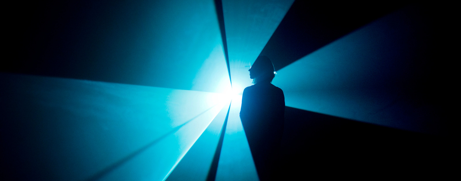 You and I Horizontal by Anthony Mccall at LIGHT SHOW at Hayward Gallery 2013 Woman standing in Blue Light Beam by artist, Anthony Mccall at Hayward Gallery